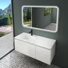 A modern bathroom vanity with a sink and mirror, set against a backdrop of a scenic mountain landscape visible through a large window. Produktbild-Vorschau