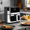 A kitchen counter scene featuring an air fryer, food, and drinks. Podgląd zdjęcia produktu