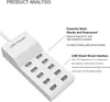 A white USB charging station with multiple ports, shown from a diagonal angle, with descriptive text overlays. Náhled obrázku produktu