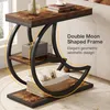 A Tribesigns 3-Tier Beistelltisch with a moon-shaped frame is shown next to a couch, with decorative items on its shelves. Produktbild-Vorschau