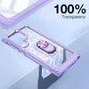 A transparent phone case with a purple frame and a silver ring holder is displayed on a light blue and gray background. Produktbild-Vorschau