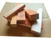 A pile of wooden blocks on a cardboard surface. Voir les images du produit