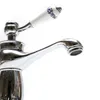 A close-up shot of a chrome faucet with a decorative ceramic handle. Produktbild-Vorschau