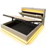 A modern bed frame with its storage compartment open and illuminated by LED lights. Produktbild-Vorschau