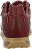 The back view of a red leather sneaker with a tan sole. Voir les images du produit