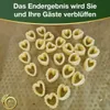 Heart-shaped pasta pieces are arranged on a brown surface, with a green and gold banner at the top containing German text. Podgląd zdjęcia produktu