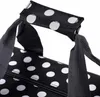 Close-up of a polka dot bag handle and zipper. Produktbild-Vorschau