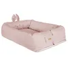 A pink baby lounger with a bunny face and ears. Produktbild-Vorschau