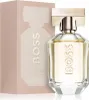 A bottle of Hugo Boss The Scent for Her Eau de Parfum and its packaging are displayed against a white background. Anteprima dell’immagine prodotto