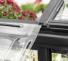 Close-up view of a greenhouse panel and frame, with flowers in the background. Produktbild-Vorschau