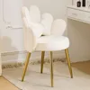 A white velvet flower-shaped accent chair with gold metal legs is shown in a room setting, next to a white vanity table. Podgląd zdjęcia produktu