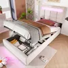 A bed with its storage compartment open, revealing stored items. The bed has LED lighting. Produktbild-Vorschau