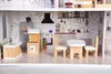 A dollhouse kitchen with miniature furniture. Anteprima dell’immagine prodotto