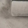 A close-up view of a soft, fluffy rug with a textured surface. Produktbild-Vorschau