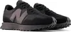 A pair of black New Balance sneakers shown from a side angle against a white background. Produktbild-Vorschau