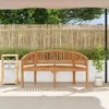 A wooden bench in an outdoor setting with a bamboo fence and plants. Produktbild-Vorschau