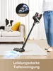 A person is using a cordless vacuum cleaner in a living room with a dog on the sofa. Produktbild-Vorschau