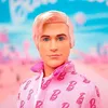 A close-up portrait of a Ken doll with pink hair and a pink patterned jacket. Produktbild-Vorschau