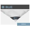 A close-up of a white duvet with a dark blue label. Produktbild-Vorschau