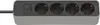 A close-up view of a black and gray power strip with four outlets and a switch. Produktbild-Vorschau
