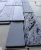 A close-up view of textured wall panels, resembling stone or wood. Náhľad obrázku produktu