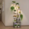 A multi-tiered plant stand with integrated grow lights, showcasing various potted plants in a home-like setting. Produktbild-Vorschau