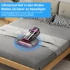 A handheld vacuum cleaner is shown on a bed, with blue rings indicating its operational area. Produktbild-Vorschau