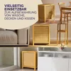 A collage of images showing a wooden laundry basket in different home settings, including next to a sofa, a dining table, and a cabinet. Produktbild-Vorschau