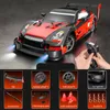 A red and black remote control drift car with various accessories displayed below. Náhľad obrázku produktu