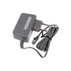 A gray power adapter with a coiled cable and a plug. Produktbild-Vorschau