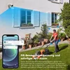 A woman is mowing the lawn in a backyard while a security camera is mounted on the house, and a smartphone displays a notification from the camera. Náhled obrázku produktu