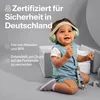 A baby wearing earmuffs sits on the floor, looking up and smiling. Anteprima dell’immagine prodotto