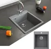 A kitchen sink with a faucet, surrounded by kitchen counter and some vegetables. Anteprima dell’immagine prodotto