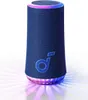 A blue cylindrical speaker with a glowing light ring at the top and bottom, and a logo on the front. Náhled obrázku produktu