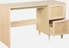 A light wood desk with rattan drawer fronts against a white background. Anteprima dell’immagine prodotto