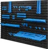 A black pegboard wall with various blue plastic tool holders and shelves attached. Náhľad obrázku produktu