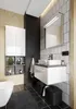 A modern bathroom with a sink, vanity, storage, and a bathtub. Podgląd zdjęcia produktu
