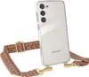 A transparent phone case with a decorative strap attached to it, shown against a white background. Produktbild-Vorschau