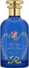 A blue glass perfume bottle with a gold cap and decorative floral label. Anteprima dell’immagine prodotto