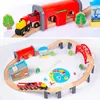 A split image showing two different arrangements of a wooden train set for children. Produktbild-Vorschau