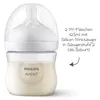 A Philips Avent baby bottle filled with milk, with a clear cap and nipple. Produktbild-Vorschau
