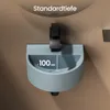 A close-up view of a compact wall-mounted sink with a faucet, showing a water level measurement. Anteprima dell’immagine prodotto