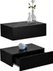 Two black floating shelves against a white background. The top shelf has two glass vases and a white flower. The bottom shelf has a light blue decorative object and an open drawer. Voir les images du produit