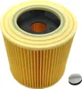 A close-up, studio shot of a vacuum cleaner filter and a small gray cap. Produktbild-Vorschau