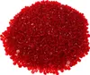 A pile of small, transparent red plastic beads. Produktbild-Vorschau