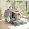 Two cats are on and around a modern, enclosed litter box on a balcony. Náhled obrázku produktu
