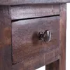 A close-up view of a wooden drawer with a dark metal knob. Náhled obrázku produktu