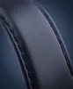 A close-up shot of the stitching and texture of a black leather watch strap. Podgląd zdjęcia produktu