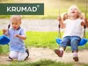 Two young children are happily playing on swings outdoors. Anteprima dell’immagine prodotto