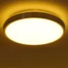 A close-up shot of a modern, circular ceiling light fixture. Produktbild-Vorschau